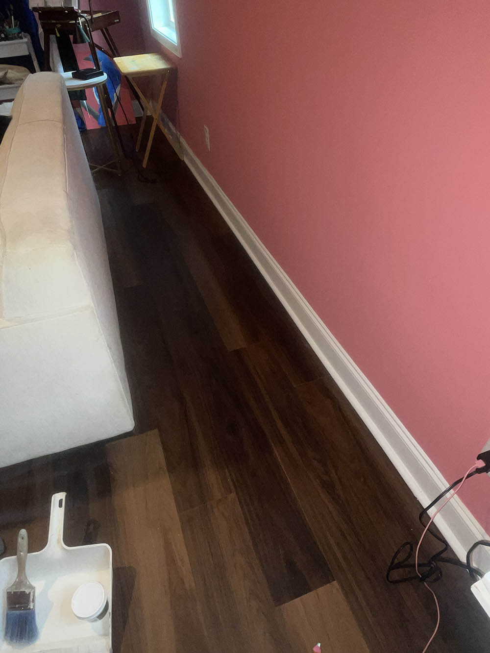 Repaired wall flood cut and baseboard painted in custom Sakura flat finish in Southern Pines NC